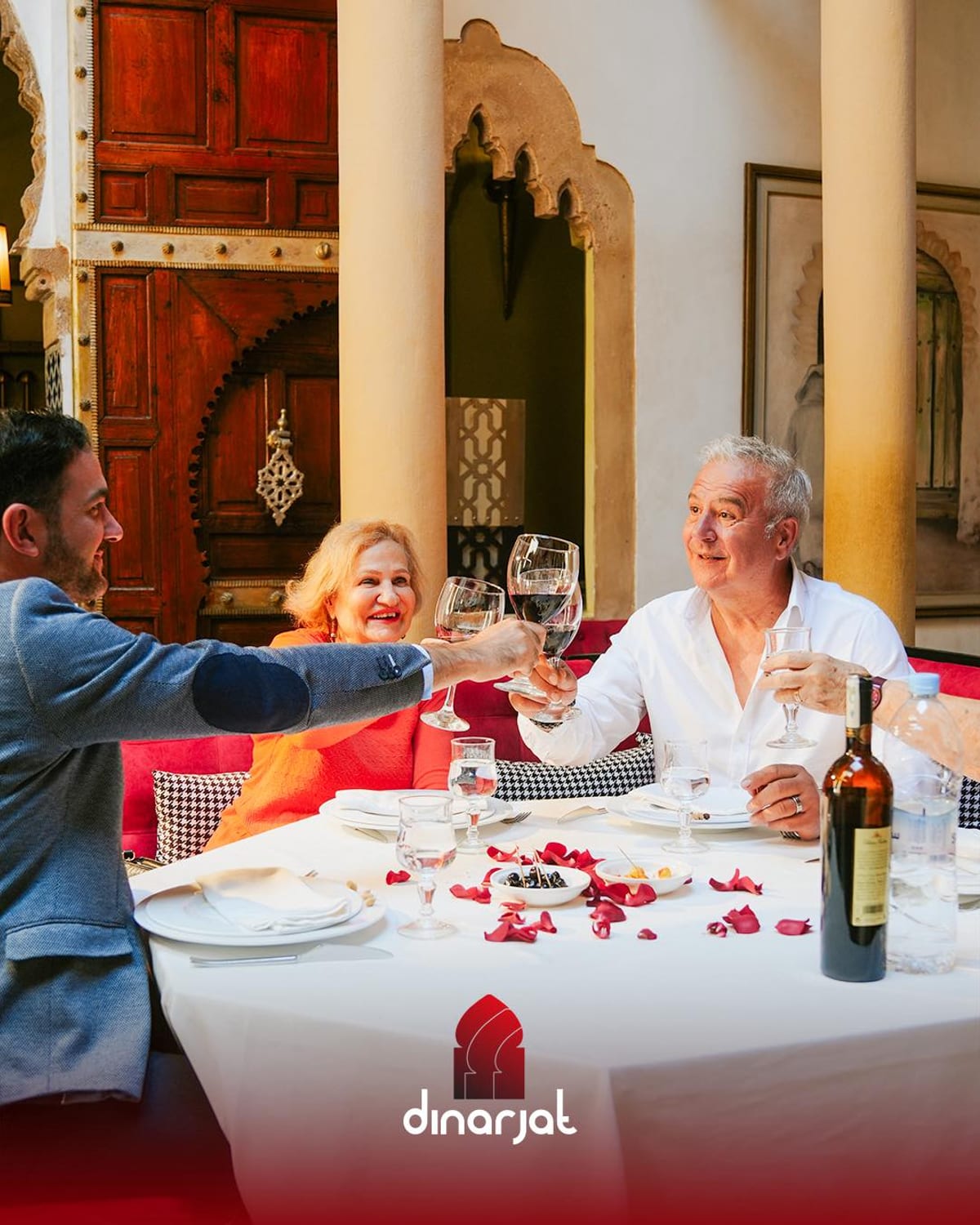 Wine being poured at a table at Dinarjat