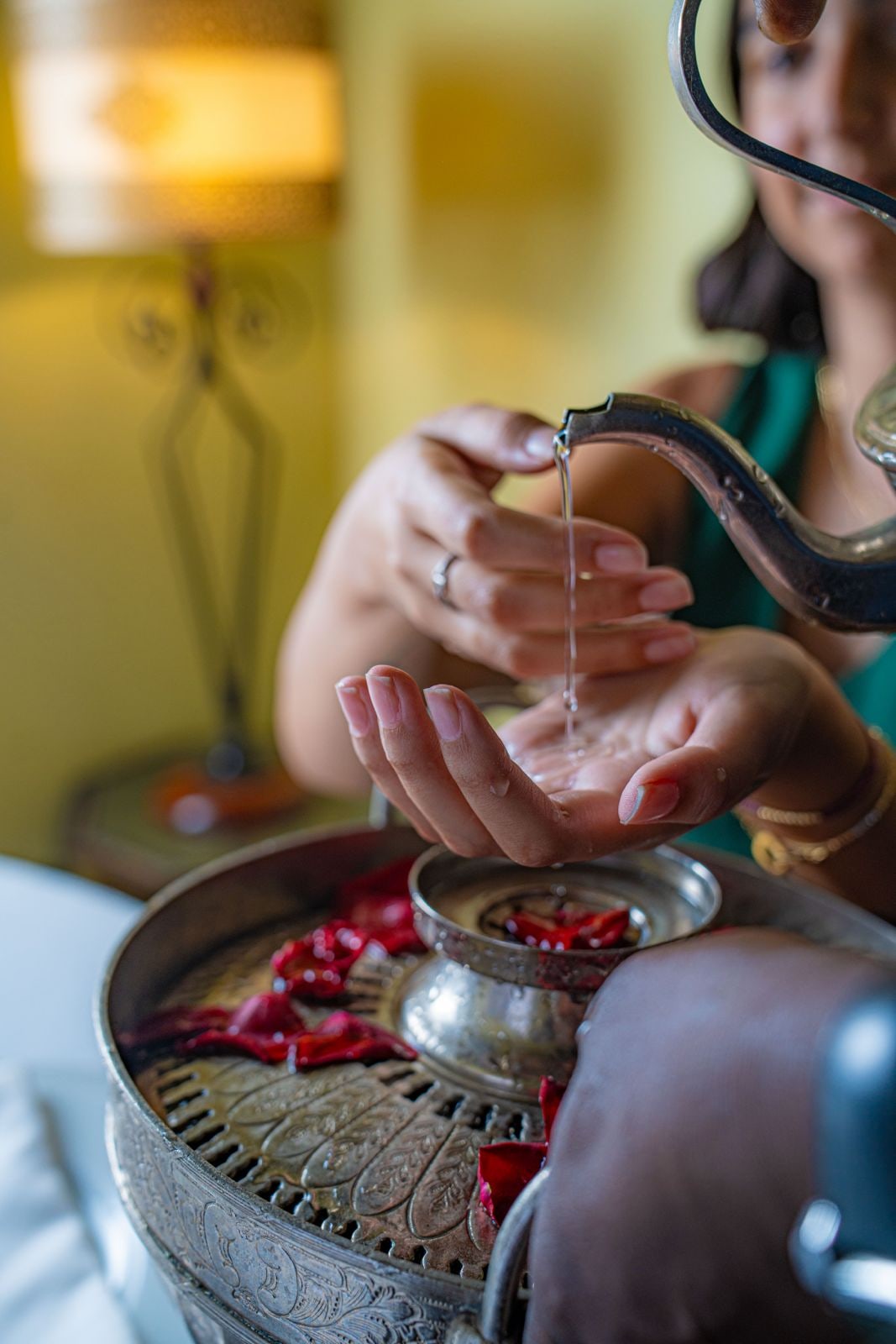 Traditional rose-water welcome ritual at Dinarjat in Rabat
