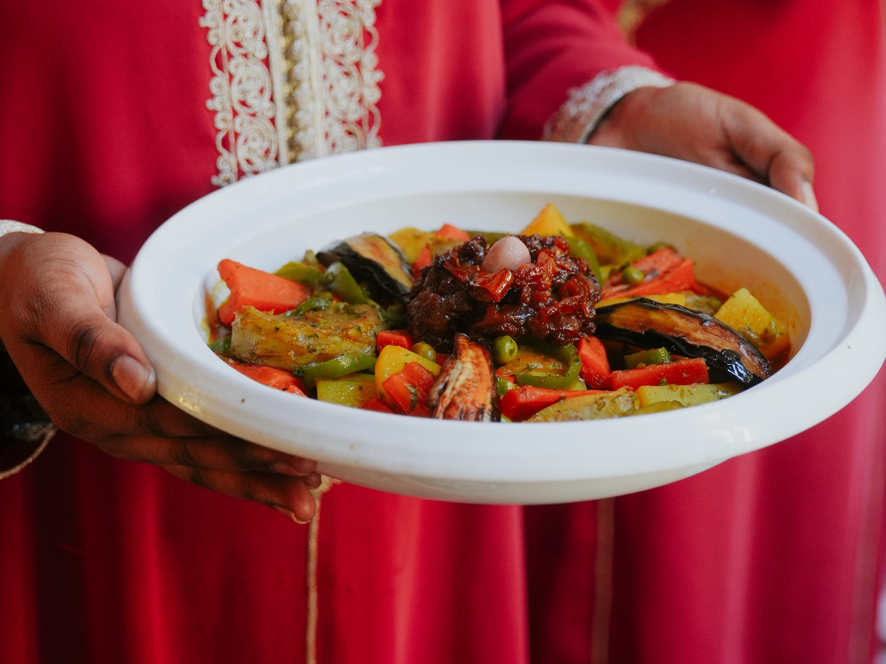 Moroccan tagine being served at Dinarjat