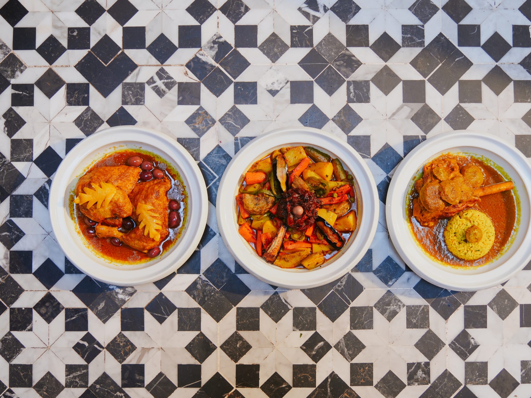 Selection of Moroccan tagines on a zellij table